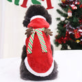 Small dog wearing the red Christmas reindeer cape with hood and scarf