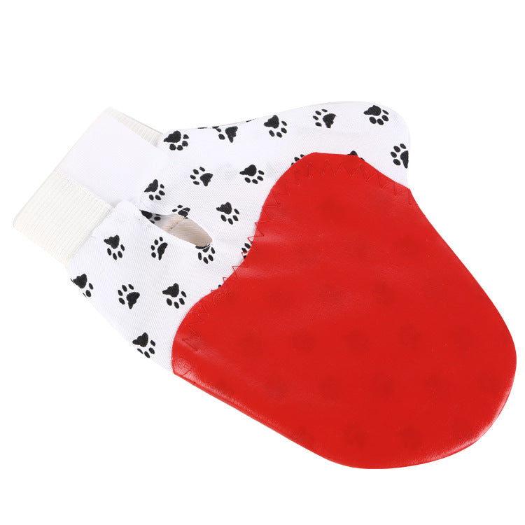 Glove grooming loose fur from pet